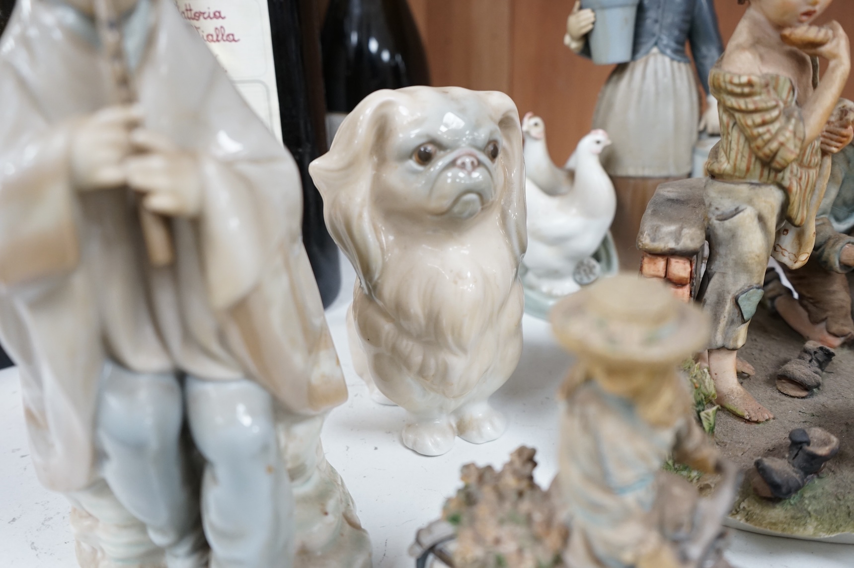 A collection of pottery and porcelain to include a Hayle model of a seal, Lladro figures and a pair of Fairy cabinet plates, largest 27cm wide